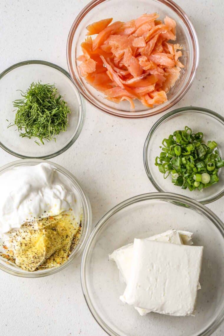All the ingredients needed for creamy salmon dip in glass bowls. 