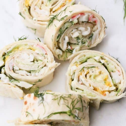 Recipe for Tortilla Crab Wheels. Pinwheels with crab, cooked eggs and cucumbers.