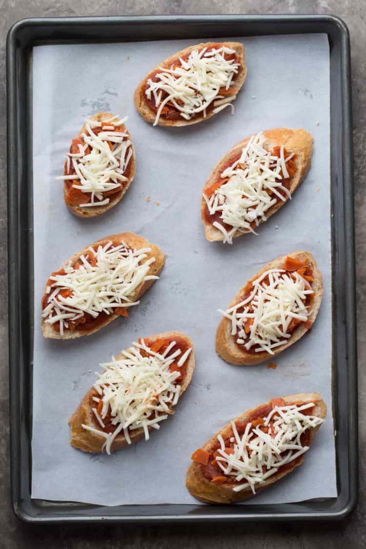 How to make cheesy pizza bites, baguettes topped with marinara sauce, pepperoni, and loads of cheese!