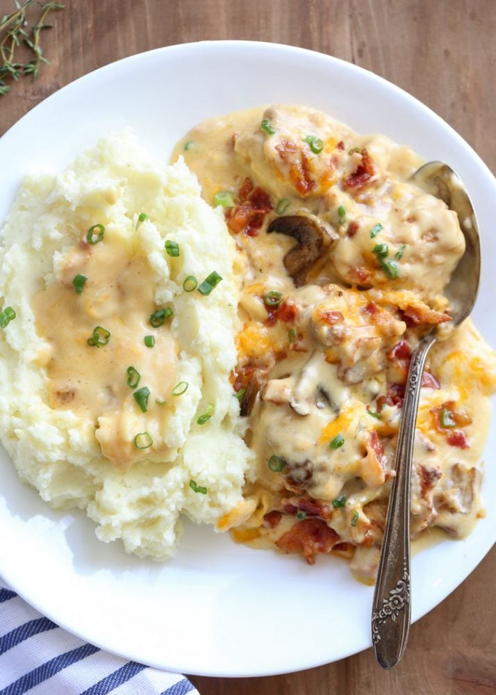 Chicken casserole on a plate with mashed potatoes. 