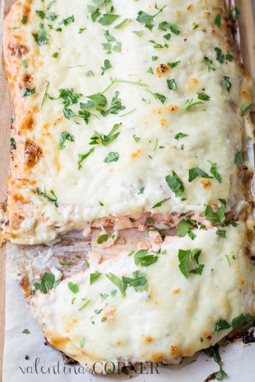 Juicy baked salmon recipe topped with a cheese and mayo topping.