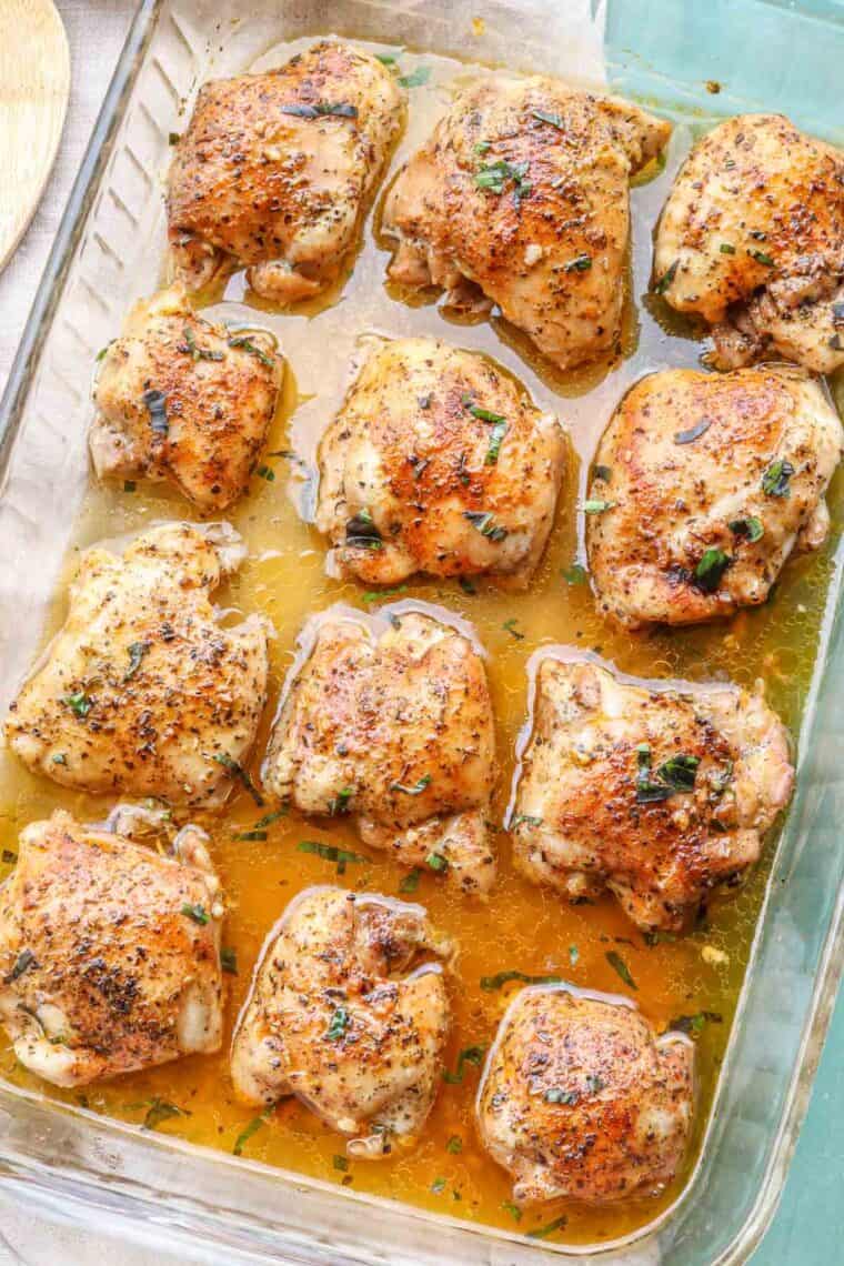 Baked chicken thigh recipe in a glass casserole dish.