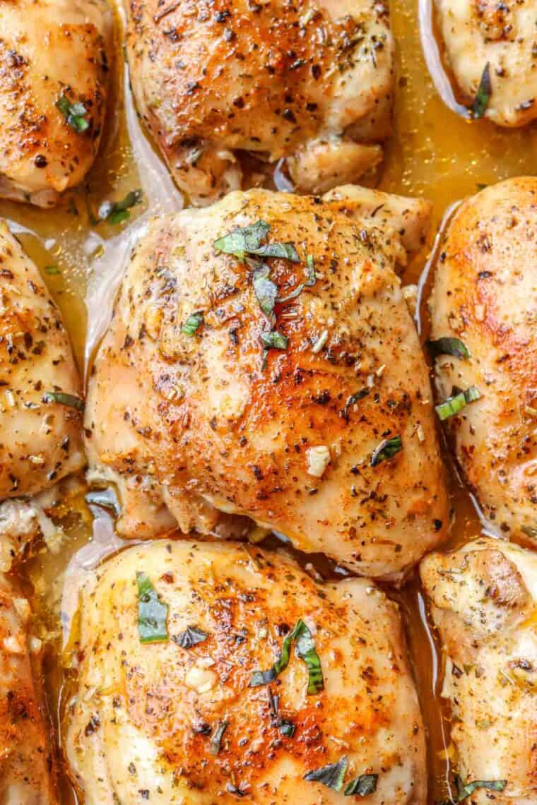 Oven baked chicken thighs in a casserole dish. 