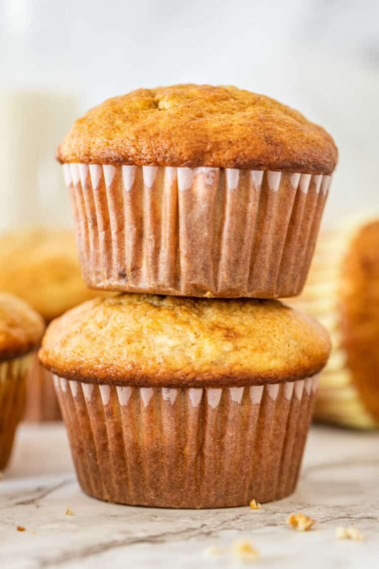 Two banana muffins stacked on top of each other. 