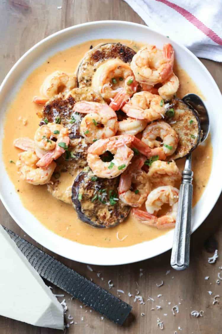 Eggplant recipe with shrimp in spicy creamy sauce with Parmesan cheese on the side.