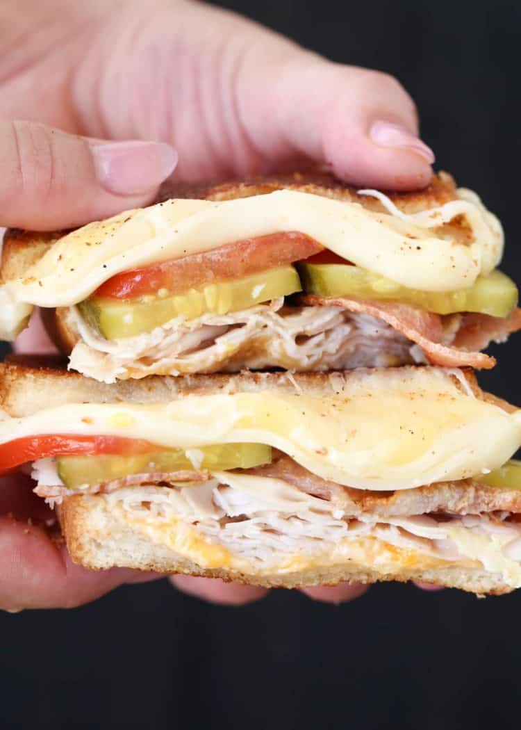 Turkey bacon grilled cheese recipe with tomatoes, pickles, and cheese.