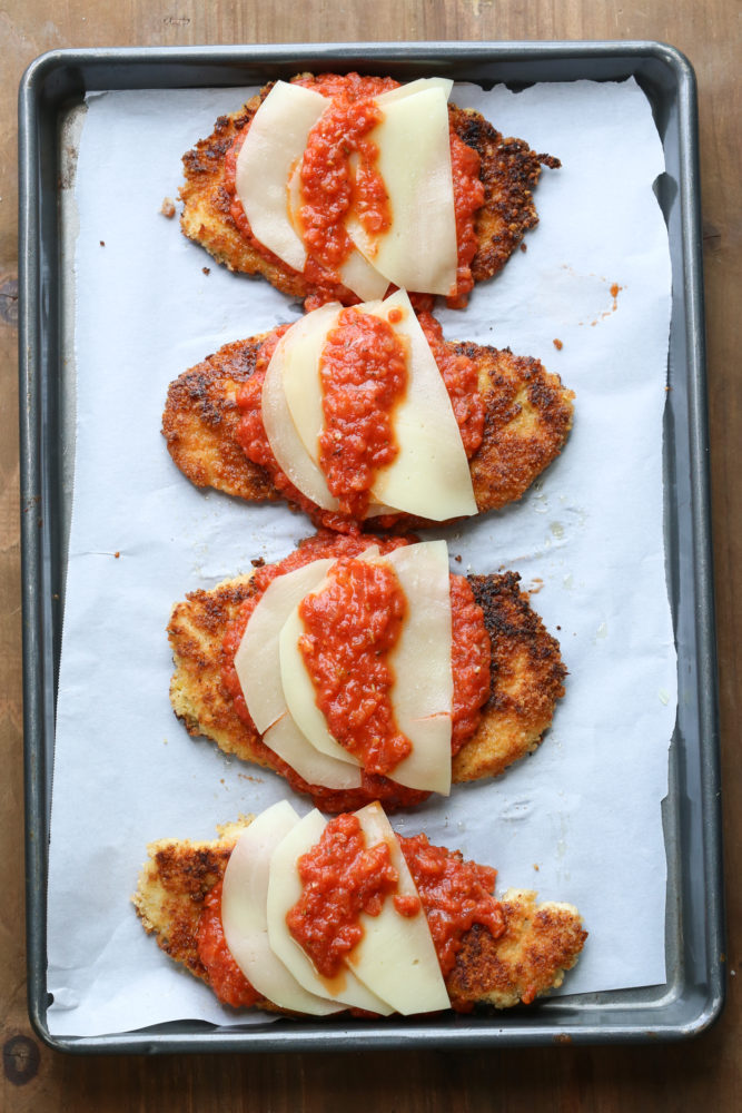 How to make chicken parmesan on a baking sheet ready to be broiled. 