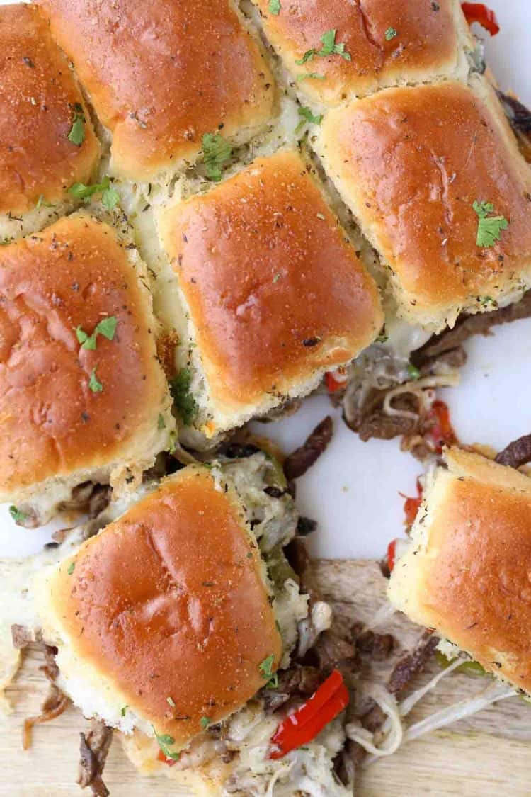 Philly cheese steak sliders pulled apart with mushrooms. Topped with cilantro.