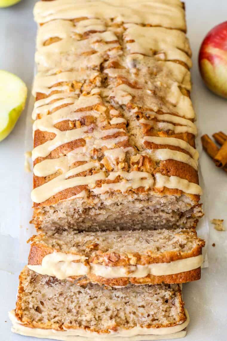 Apple bread loaf with two slices cut.