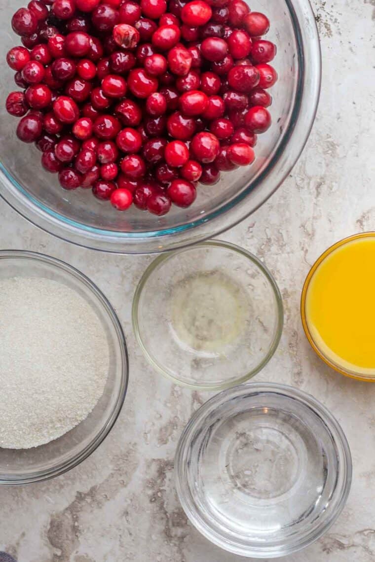 All the ingredients needed for homemade cranberry orange sauce.