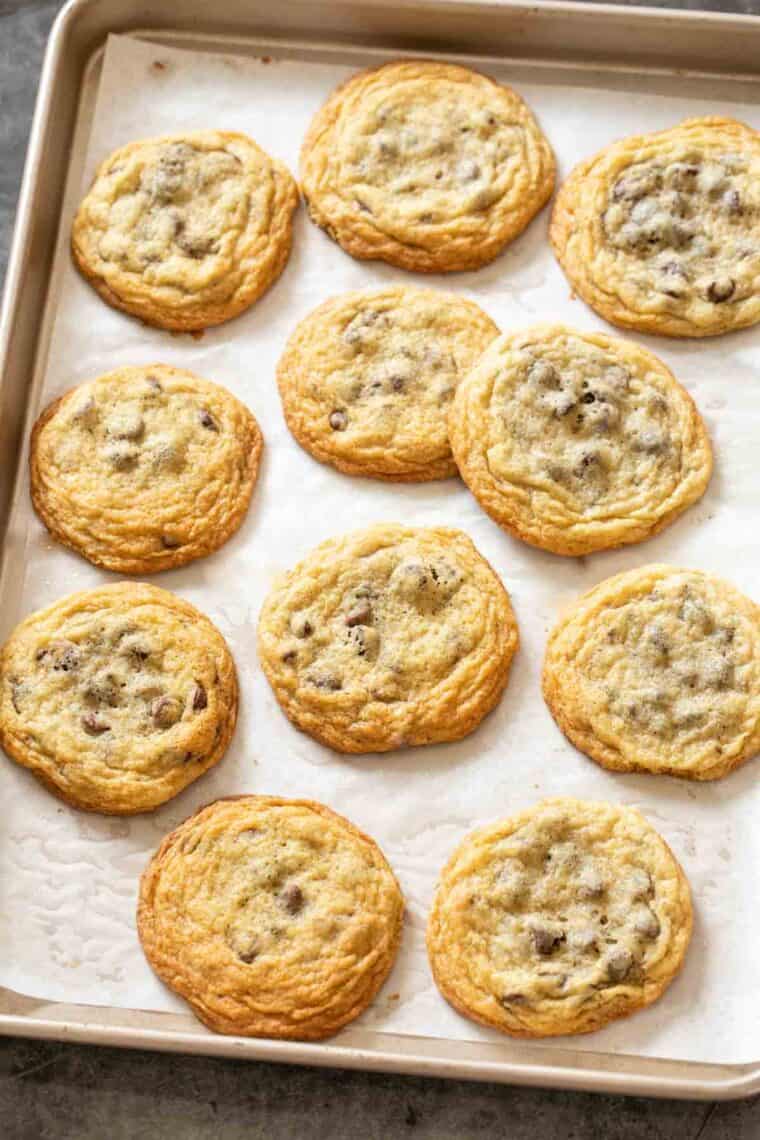 Chocolate chip cookies on a baking sheet. 