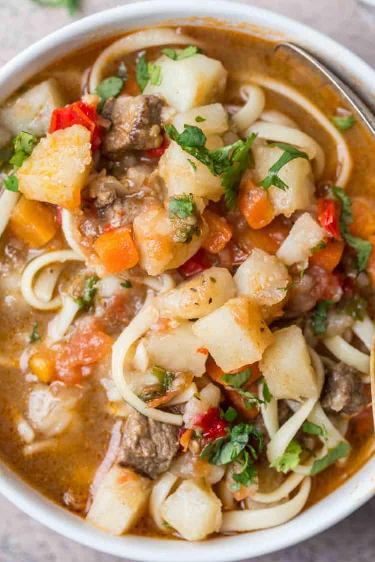 Uzbek Lagman soup with potatoes, peppers, carrots and meat. 