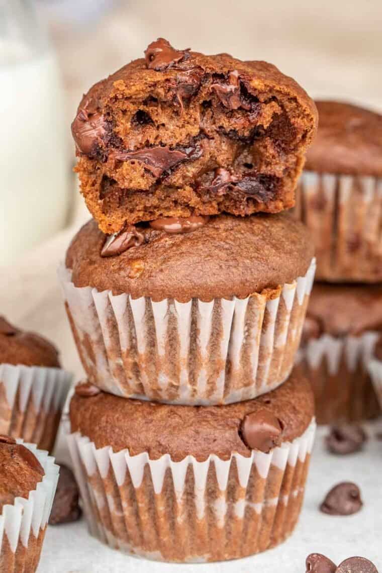 Banana muffins with chocolate chips stacked on top of each other. 