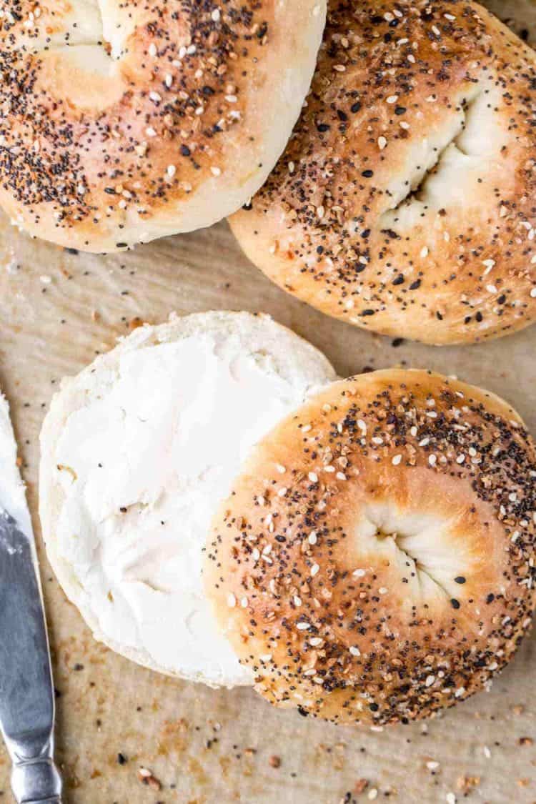 Everything bagel recipe cut in half and spread with cream cheese. 