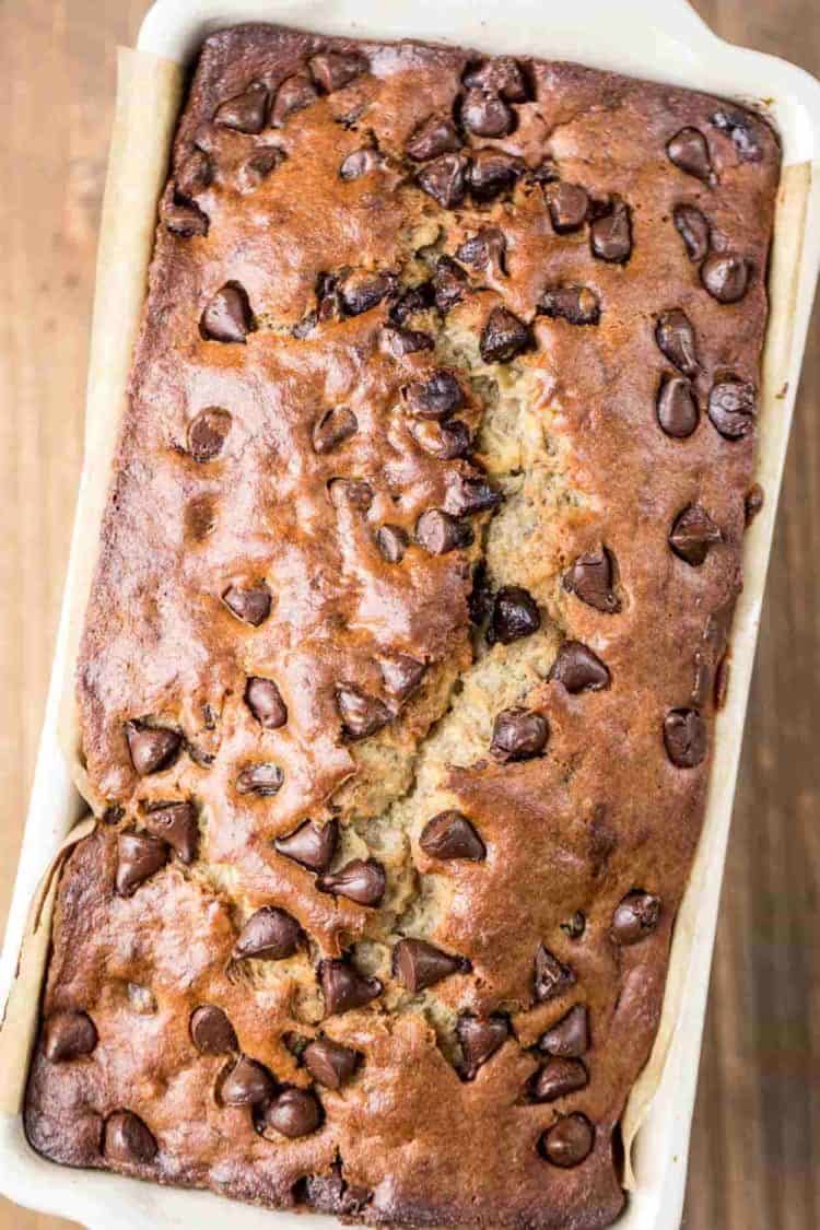 Chocolate Chip Banana bread recipe in a bread pan topped with chocolate chip morsels.