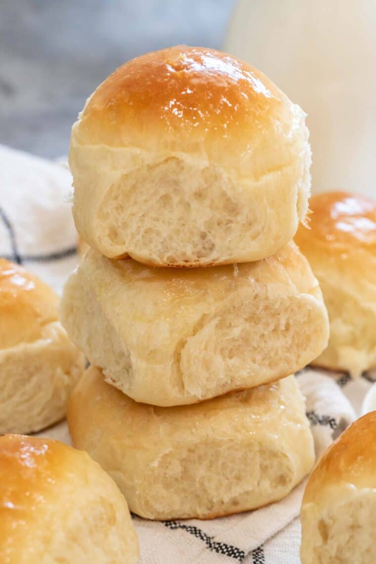 Three dinner rolls stacked on top of each other. 