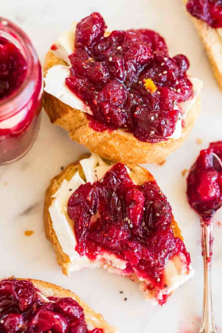 Crispy crostini topped with cranberry sauce and brie cheese.