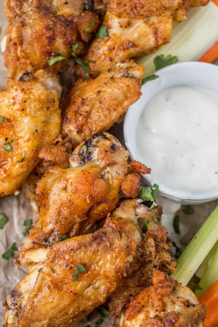 Chicken on a plate with dipping sauce. 