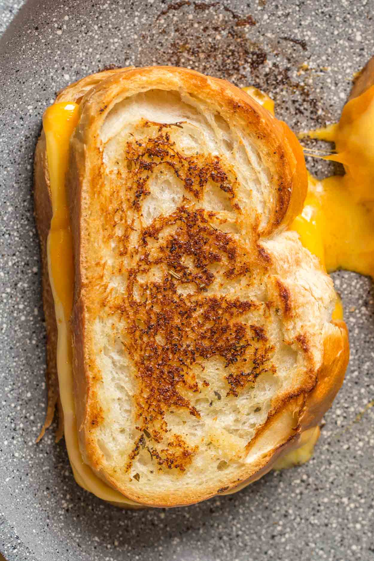 A perfectly golden brown grilled cheese sandwich. 