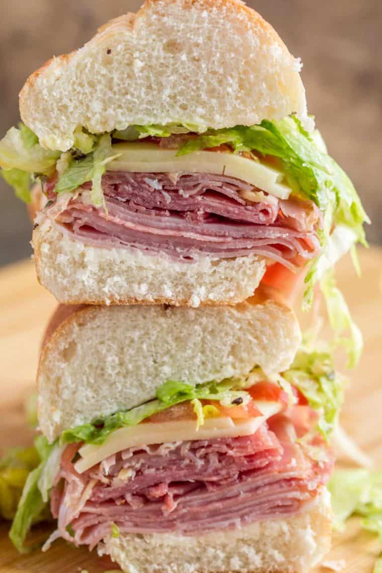 Two slices of Italian sub sandwich stacked on top of each other. 