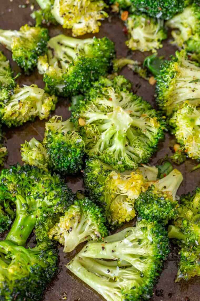 Roasted broccoli topped with parmesan cheese and ground black pepper. 