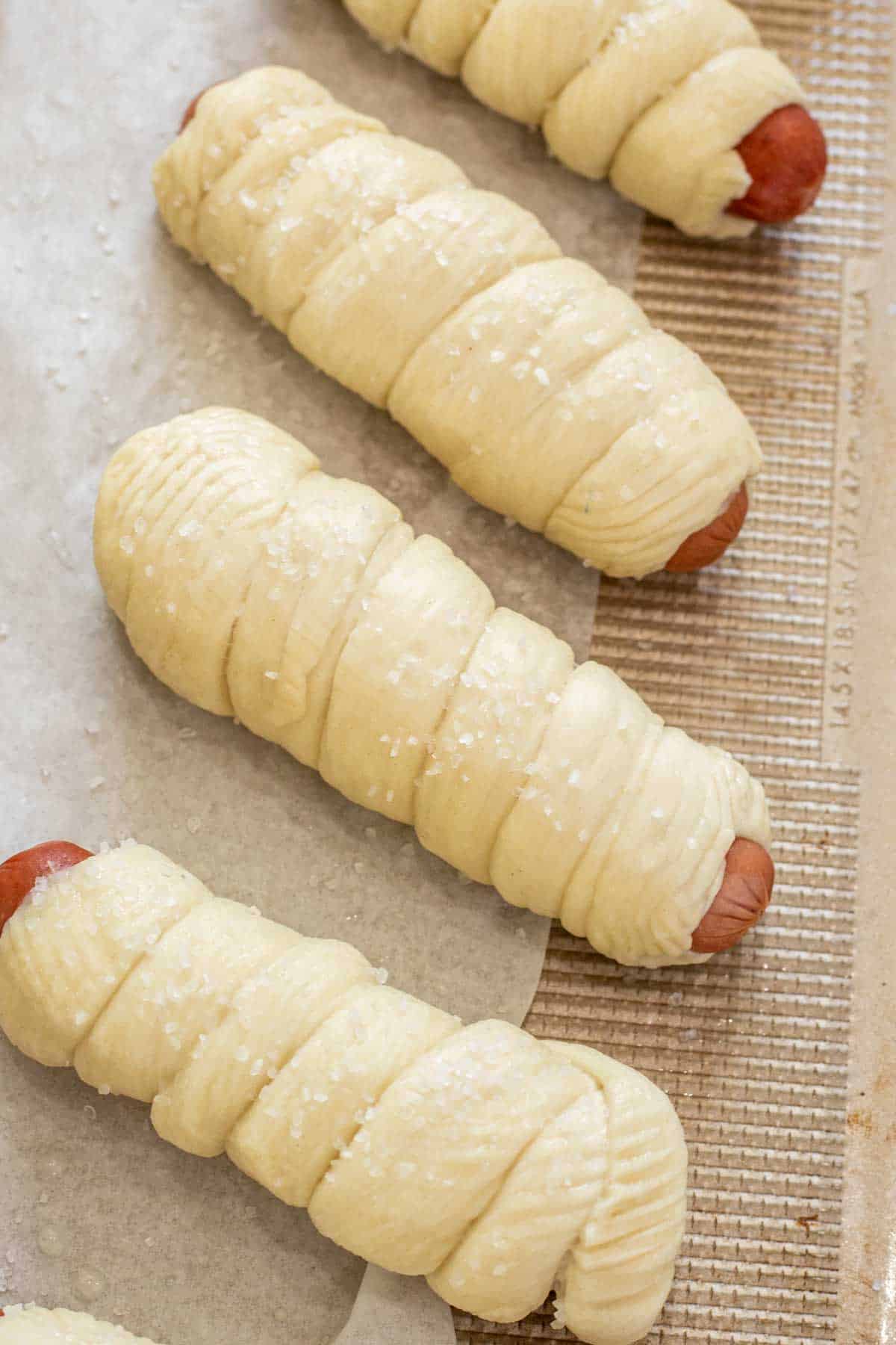 Juicy hot dogs wrapped in a homemade pretzel dough and baked to perfection. 