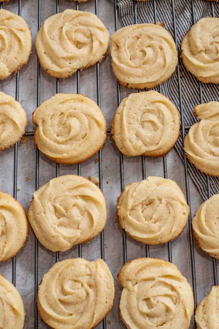 Crispy plain butter cookies on a cooling rack. 