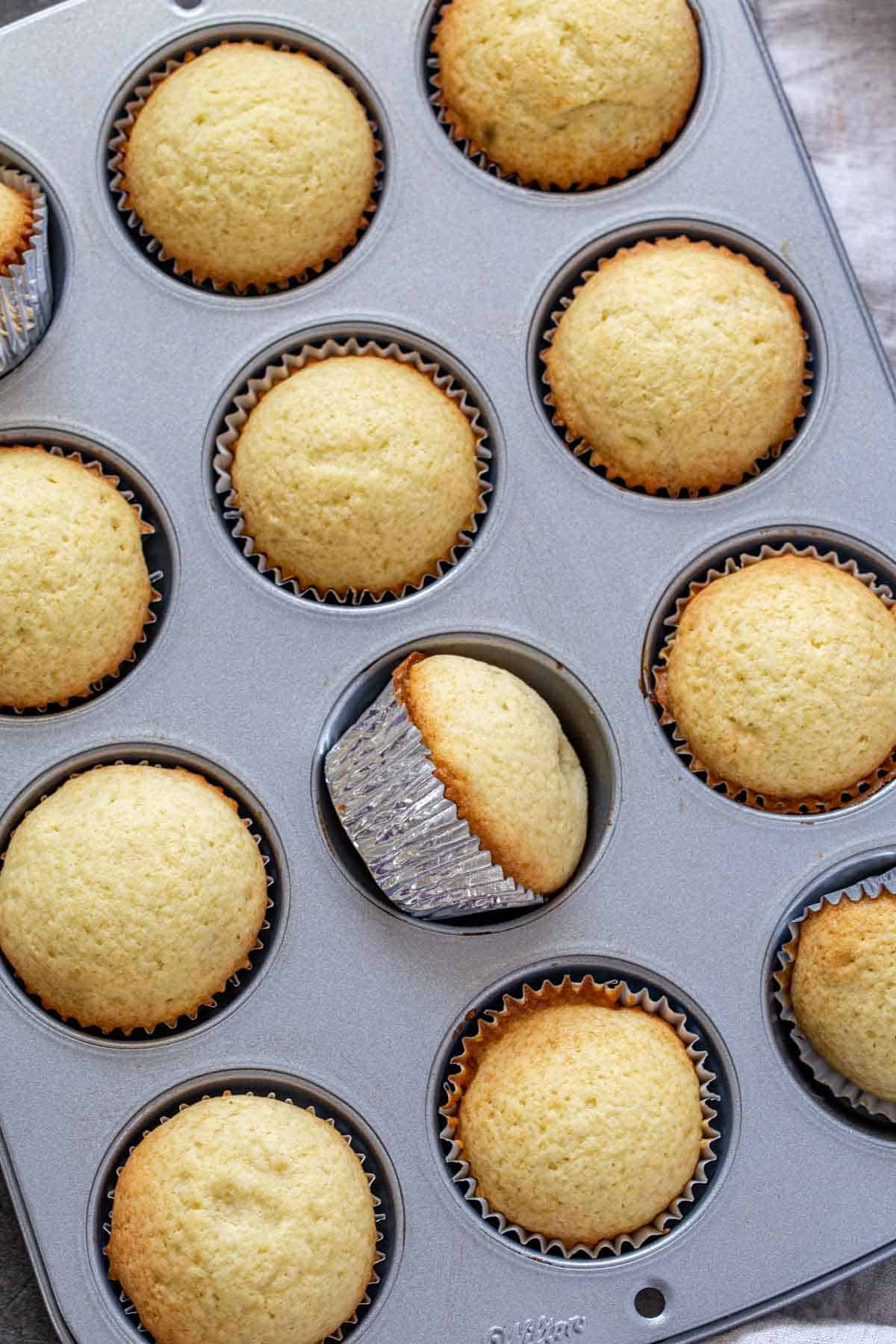 Vanilla cupcakes in the cupcake pan. 