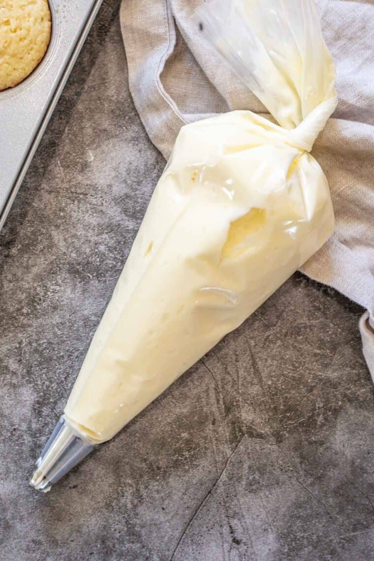 Cream cheese frosting in a piping bag. 