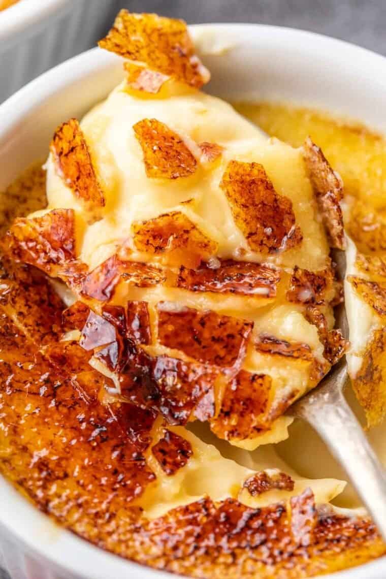A spoonful of creamy creme brulee. 