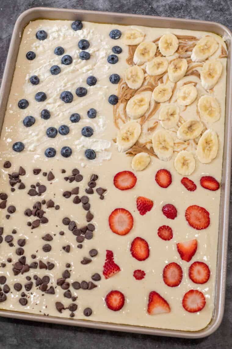 Pancake batter topped with toppings ready to be baked. 