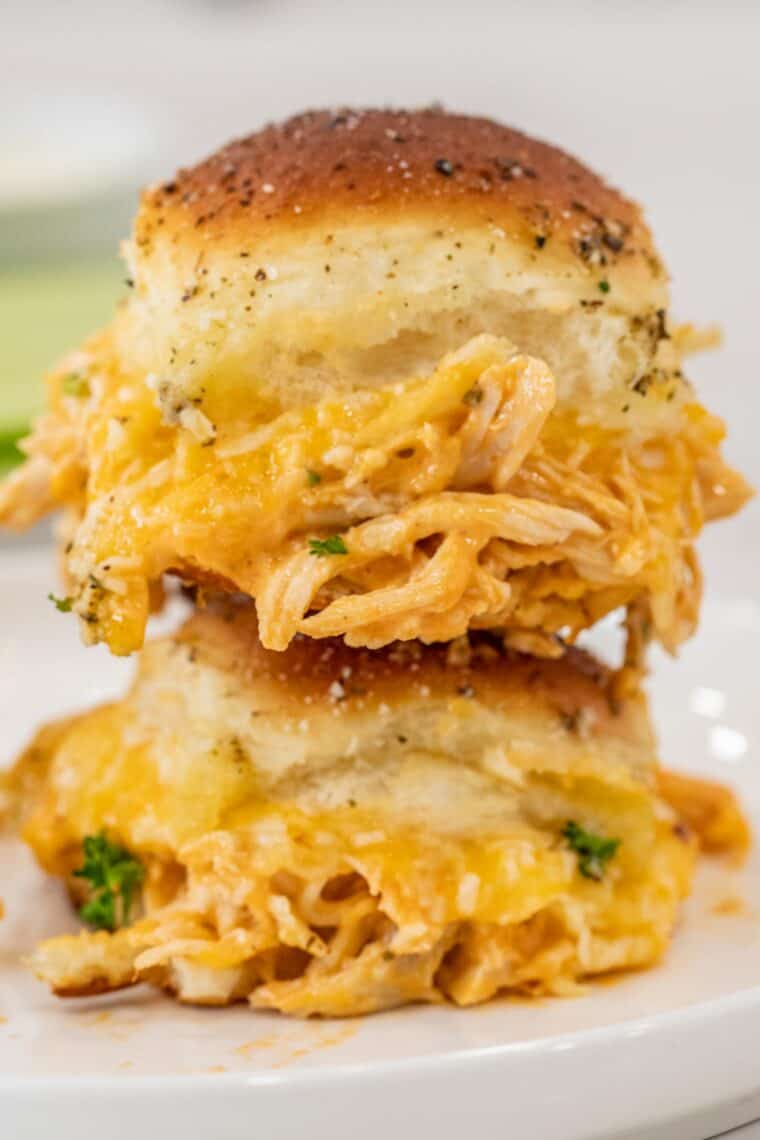 Two buffalo chicken sliders stacked on top of each other. 