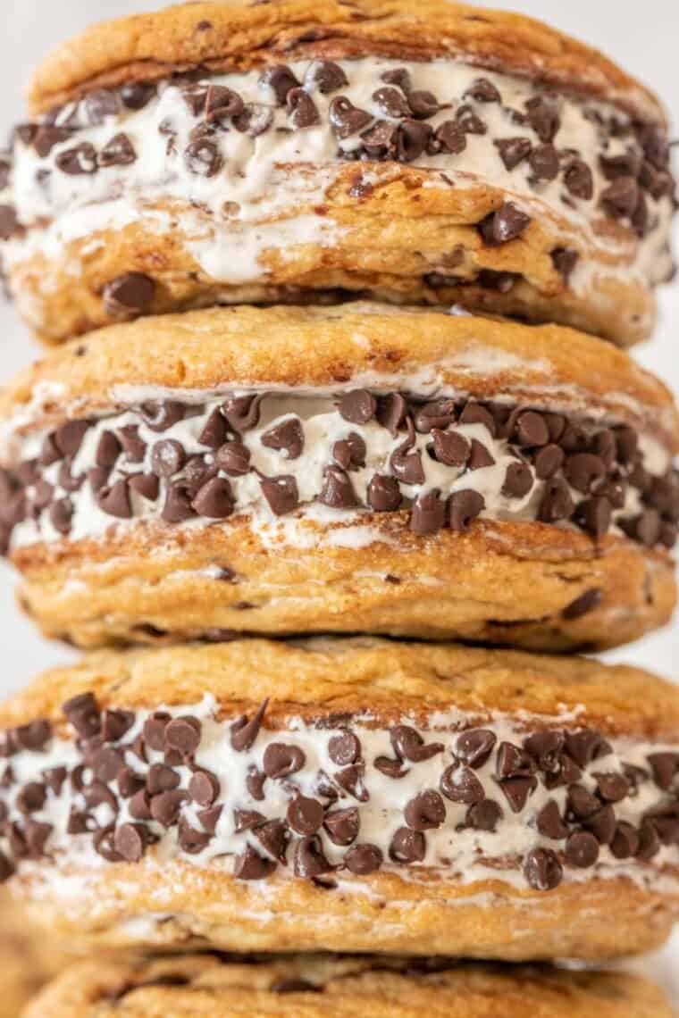 Up close picture of 3 chocolate chip ice cream sandwiches. 