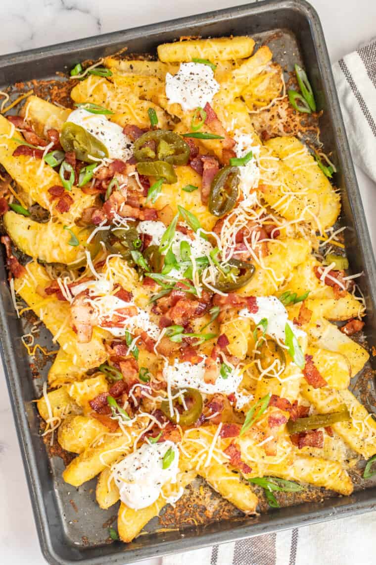 Baked cheese with loaded cheese fries topped with jalapenos, sour cream, bacon. 