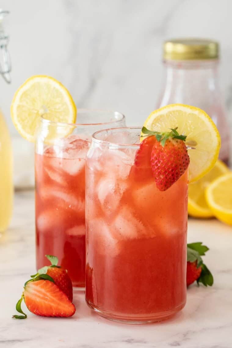 Two glasses of strawberry acai lemonade. 