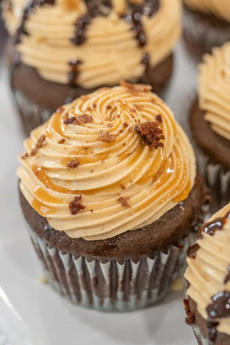 Chocolate cupcakes topped with peanut butter frosting. 
