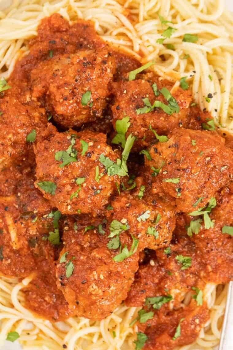 Instant pot meatballs over a bed of spaghetti. 