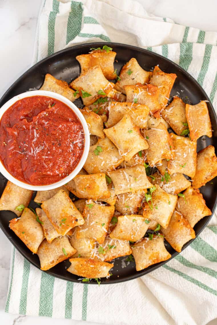 Pizza rolls on a play with side of marinara sauce