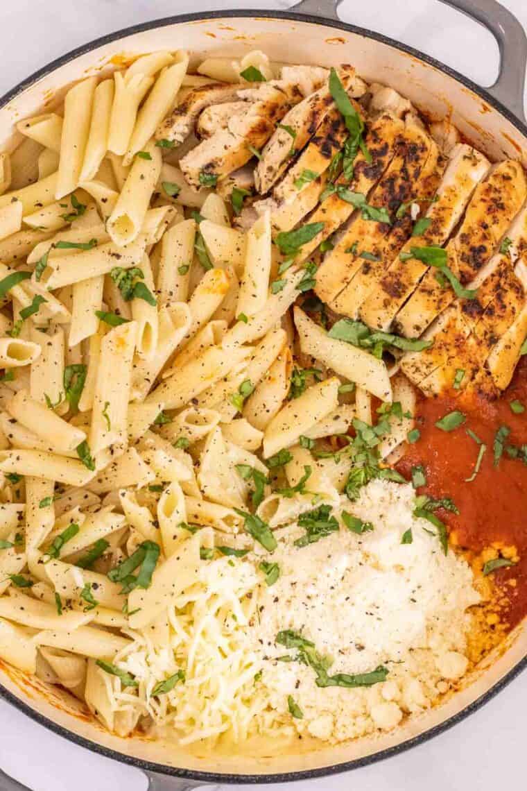 Chicken, pasta and marinara in a large skillet. 