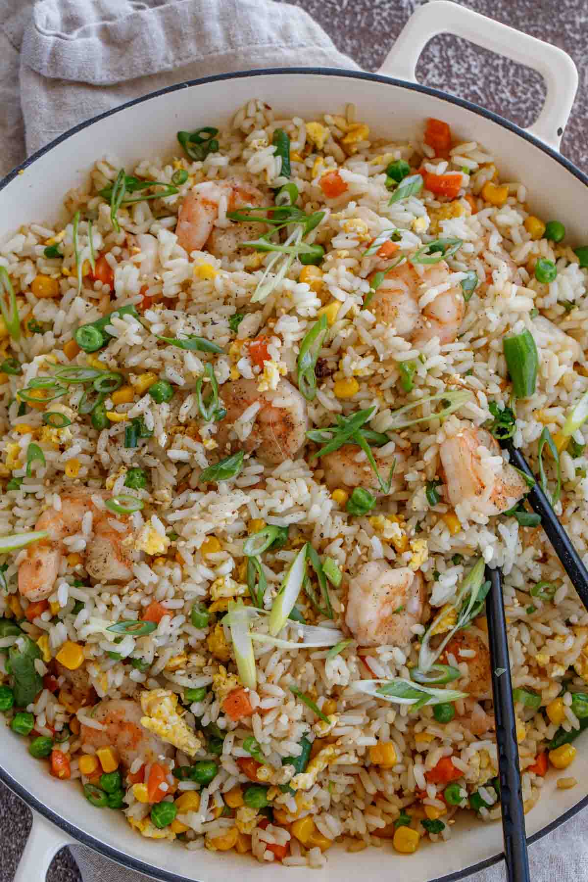 Shrimp fried rice topped with greens.
