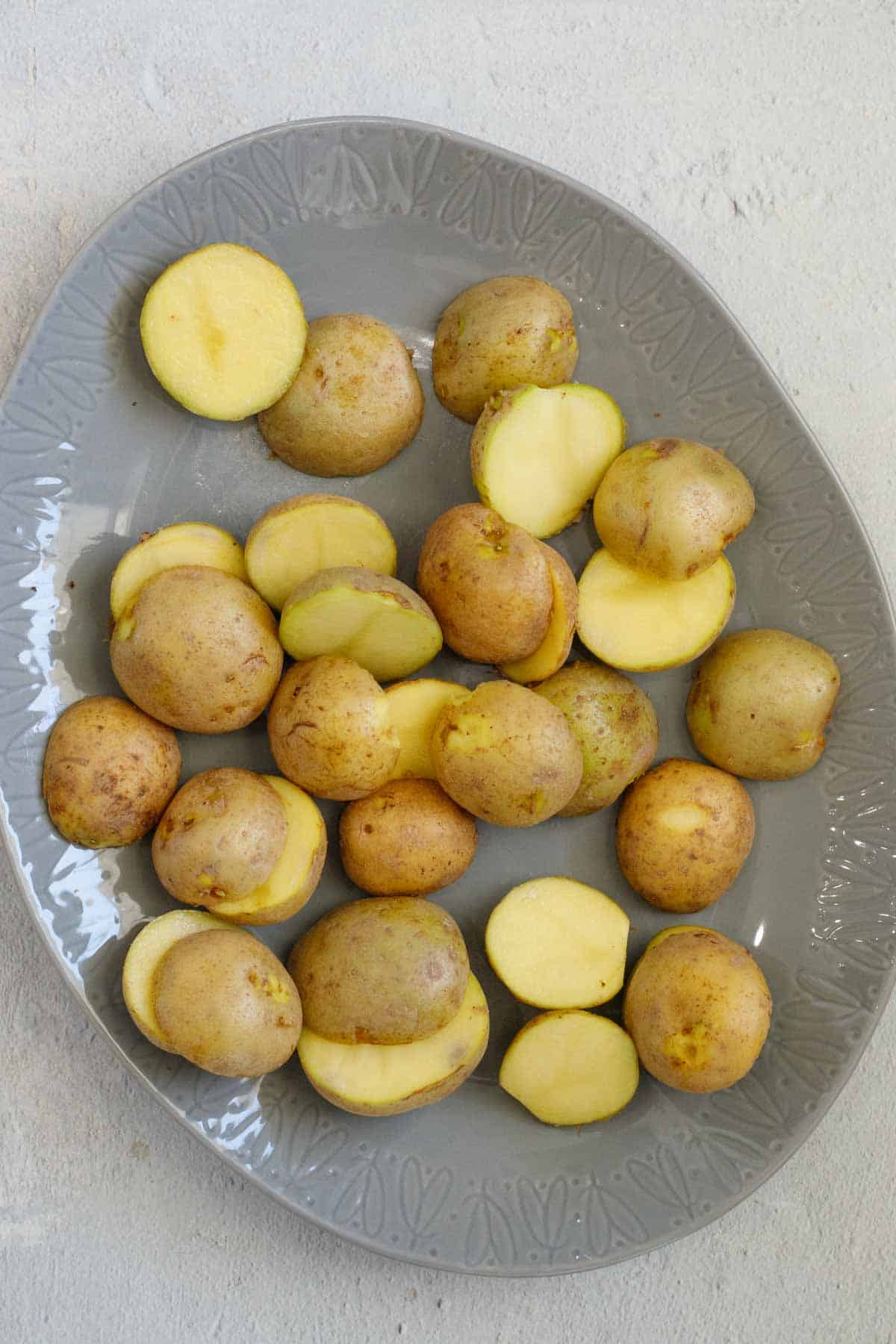 All potatoes freshly cut in a plate.