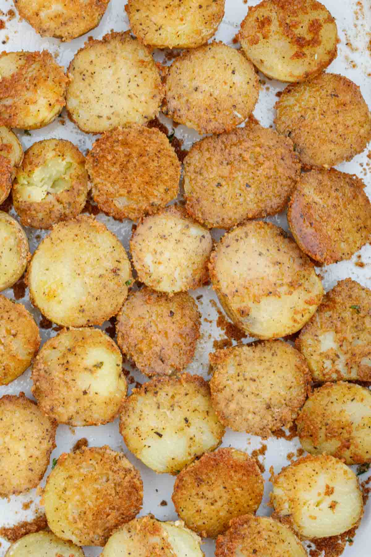 Parmesan crusted potatoes on a serving plate.