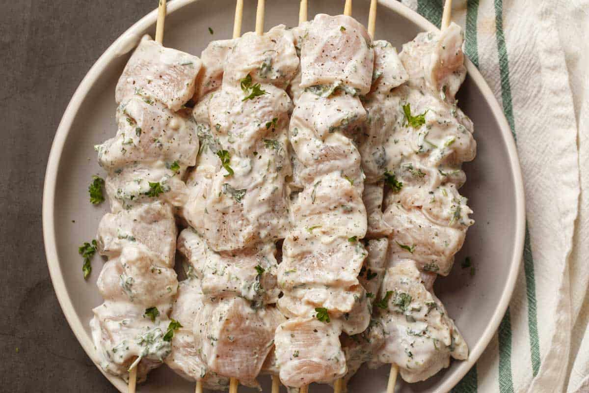 Marinated chicken kabobs ready to be grilled.