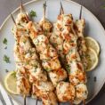 Chicken kabobs on skewers plated.