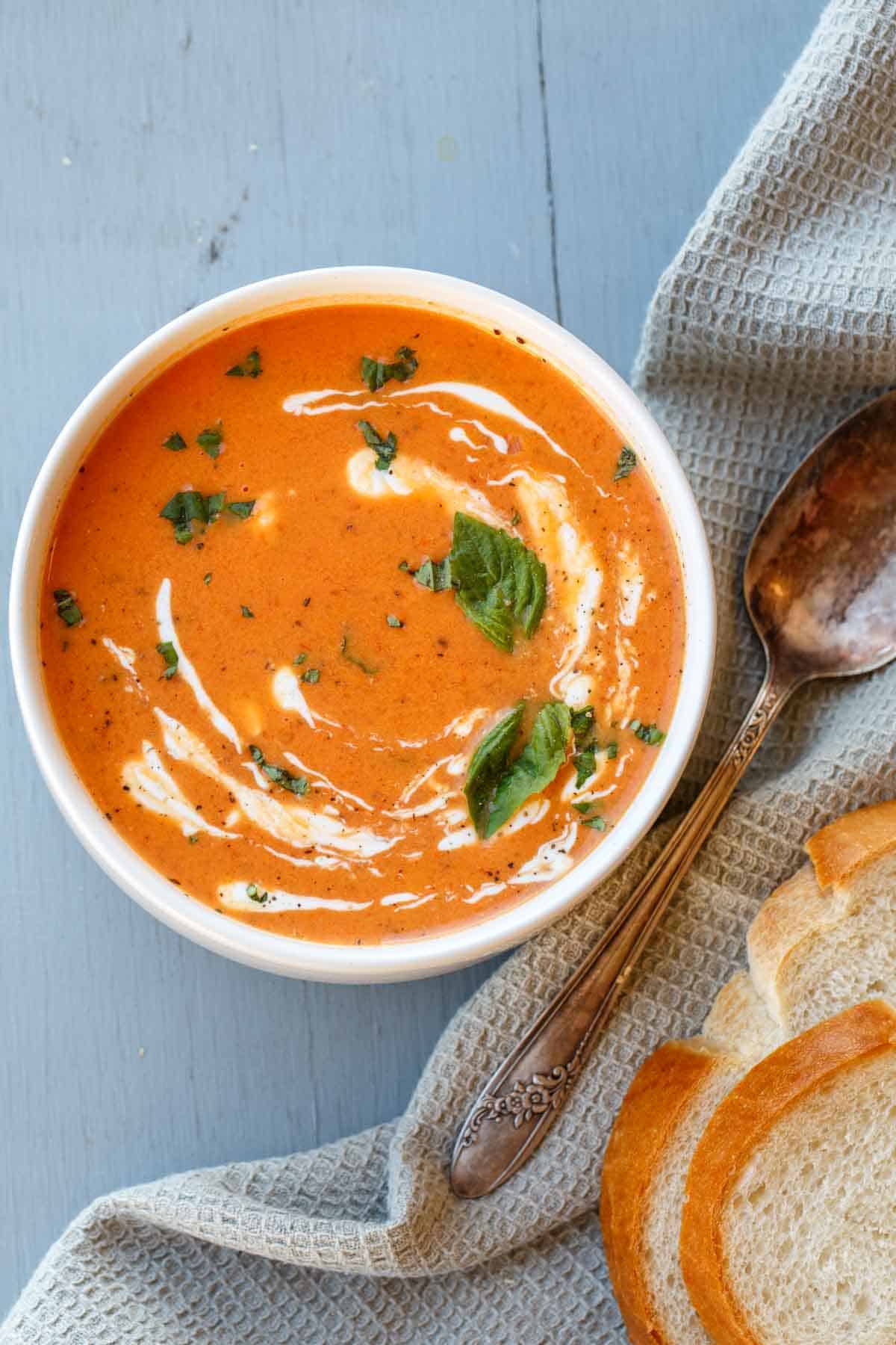 Tomato basil soup with a serving napkin.