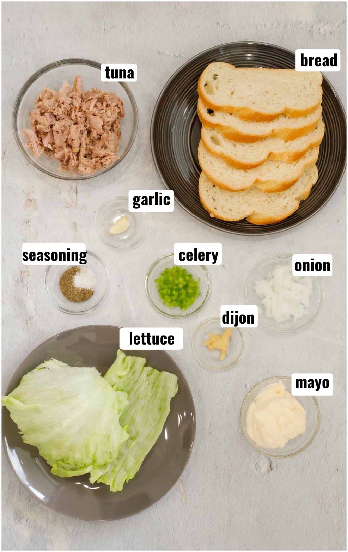 All ingredients needed to make tuna sandwiches in ramekins.