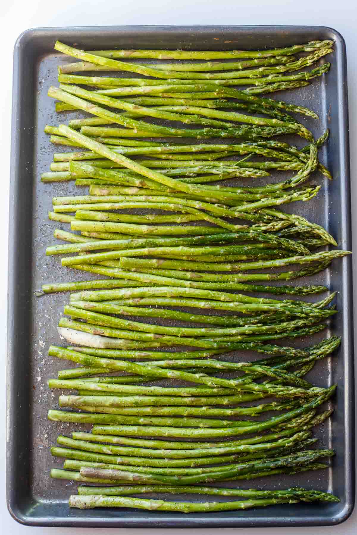Asparagus in a baking sheet.