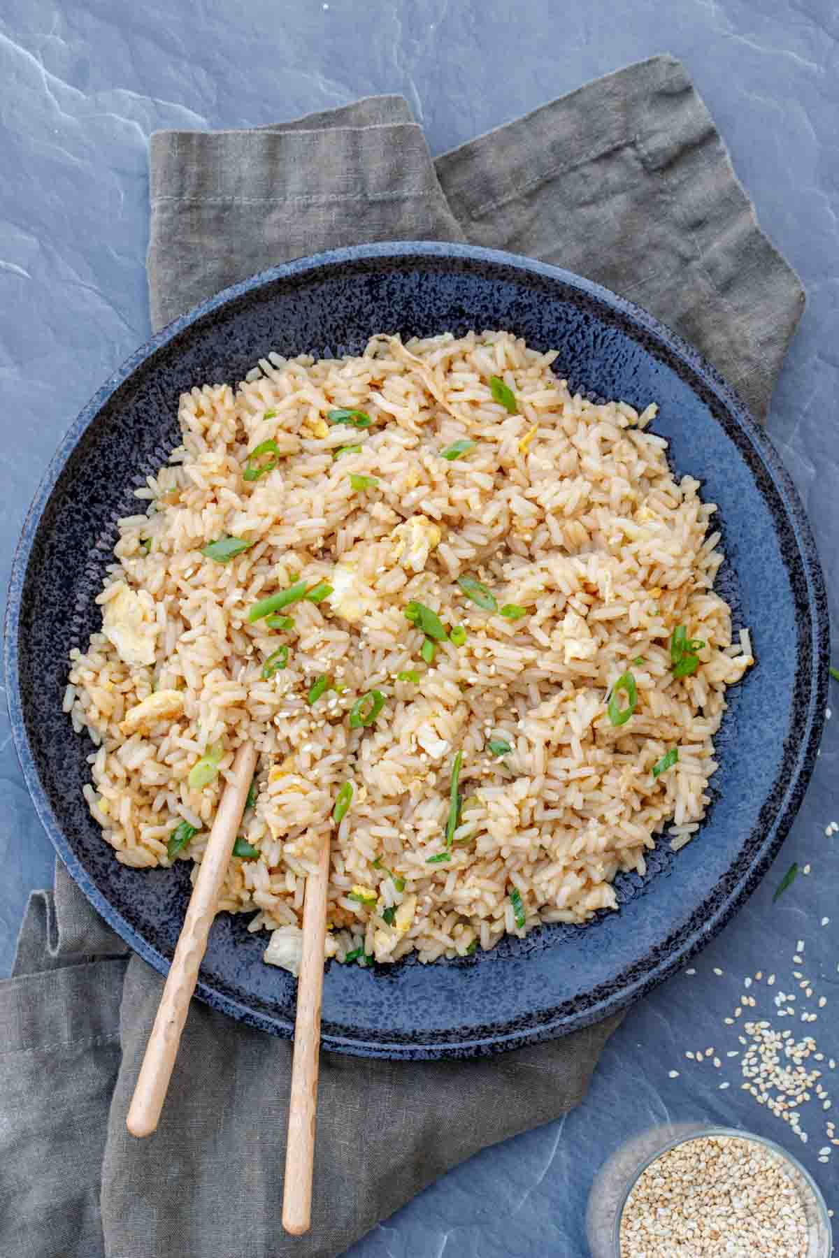 Hibachi rice with with a serving napkin and semame seeds.