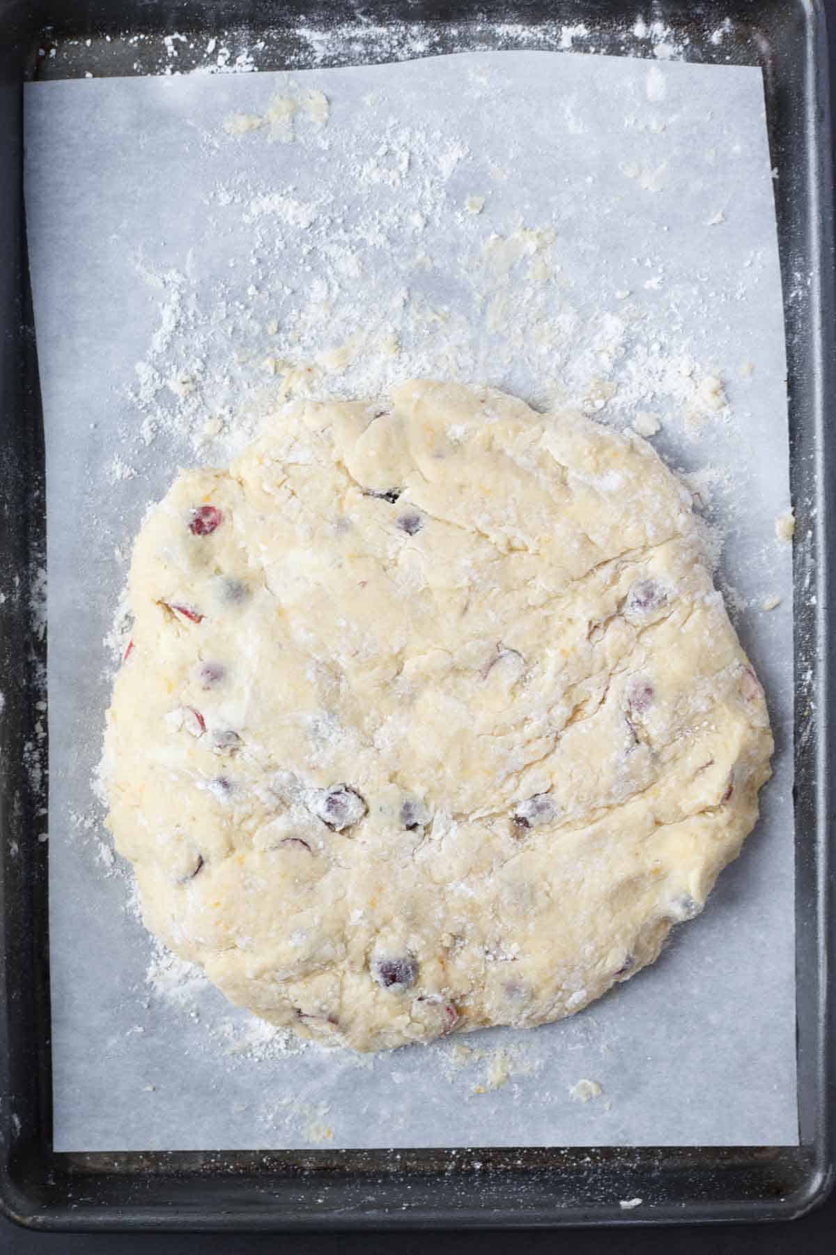 The combined scone dough, shaped into a rectangle. 