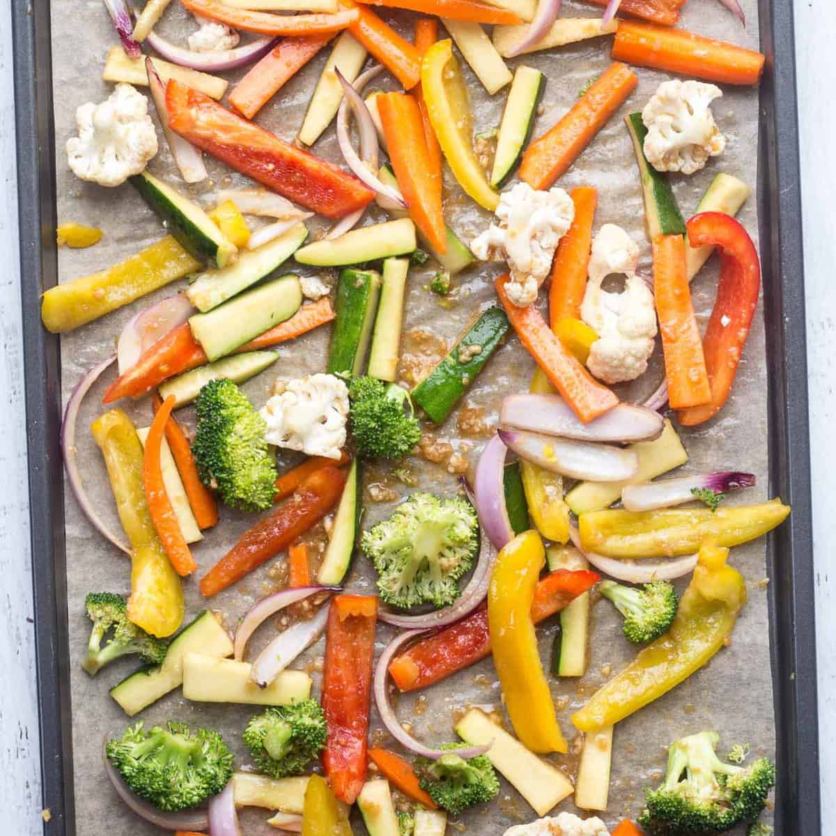 A baking pan with the vegetables spread out.